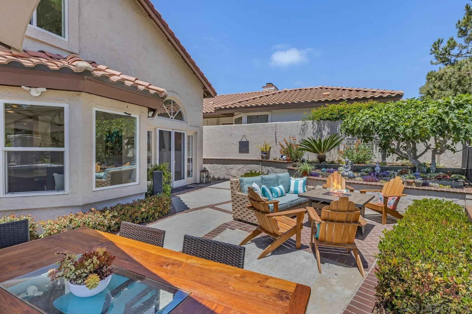 14921 Tercer Verde Del Mar, CA 92014 - Photo 33 of 37 a view of a patio with couches table and chairs and potted plants