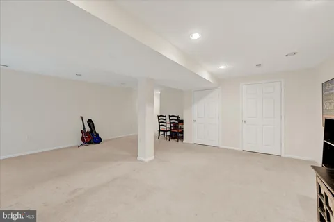 a view of a livingroom with furniture and a flat screen tv