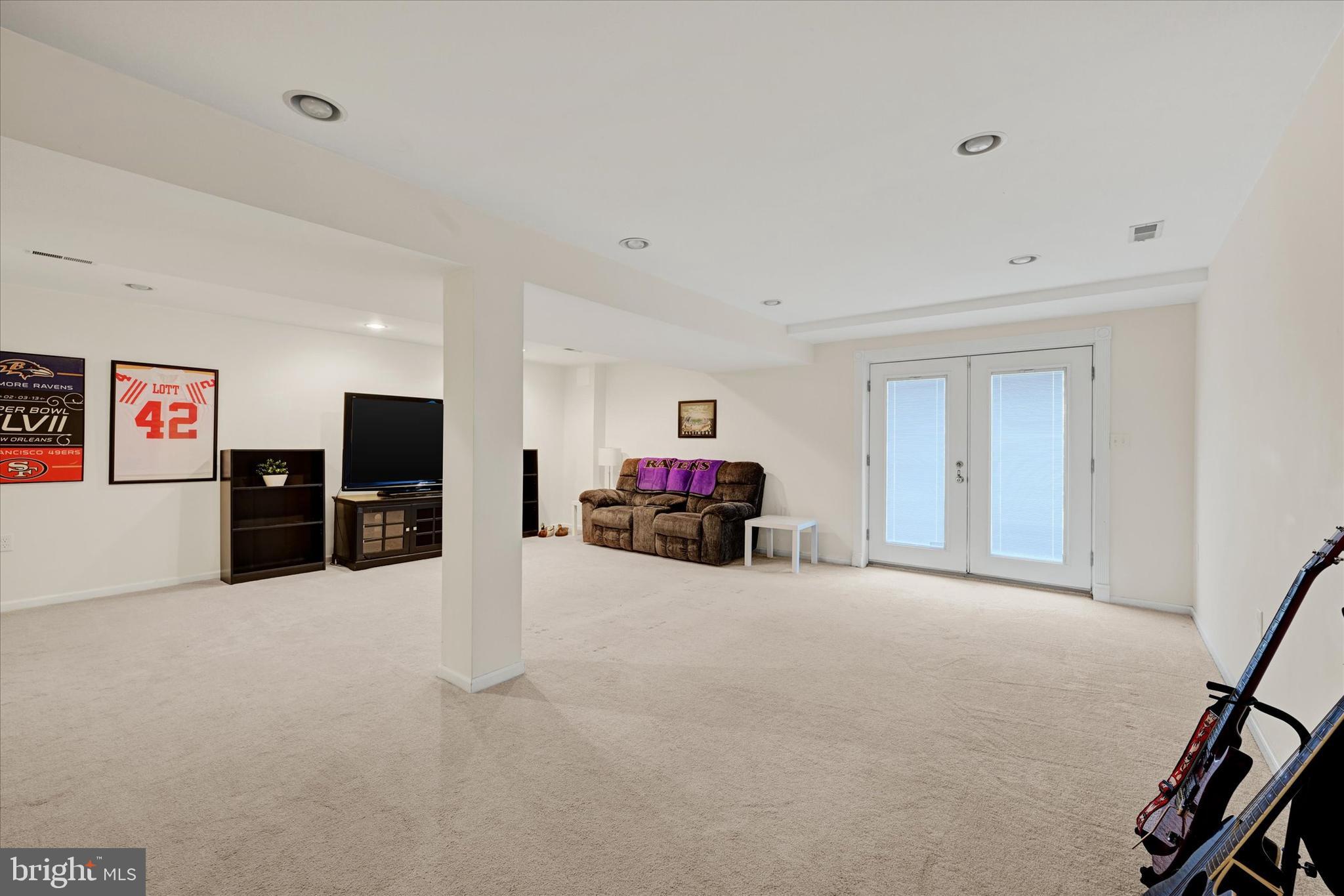 9006 Naygall Road Baltimore, MD 21234 - Photo 19 of 34 a view of a livingroom with furniture and a flat screen tv