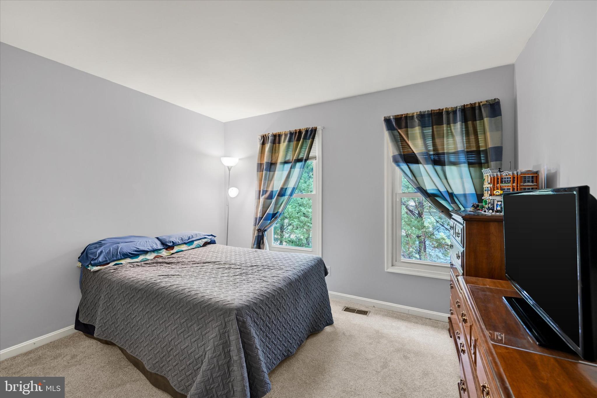 9006 Naygall Road Baltimore, MD 21234 - Photo 20 of 34 a bedroom with a bed window and mirror
