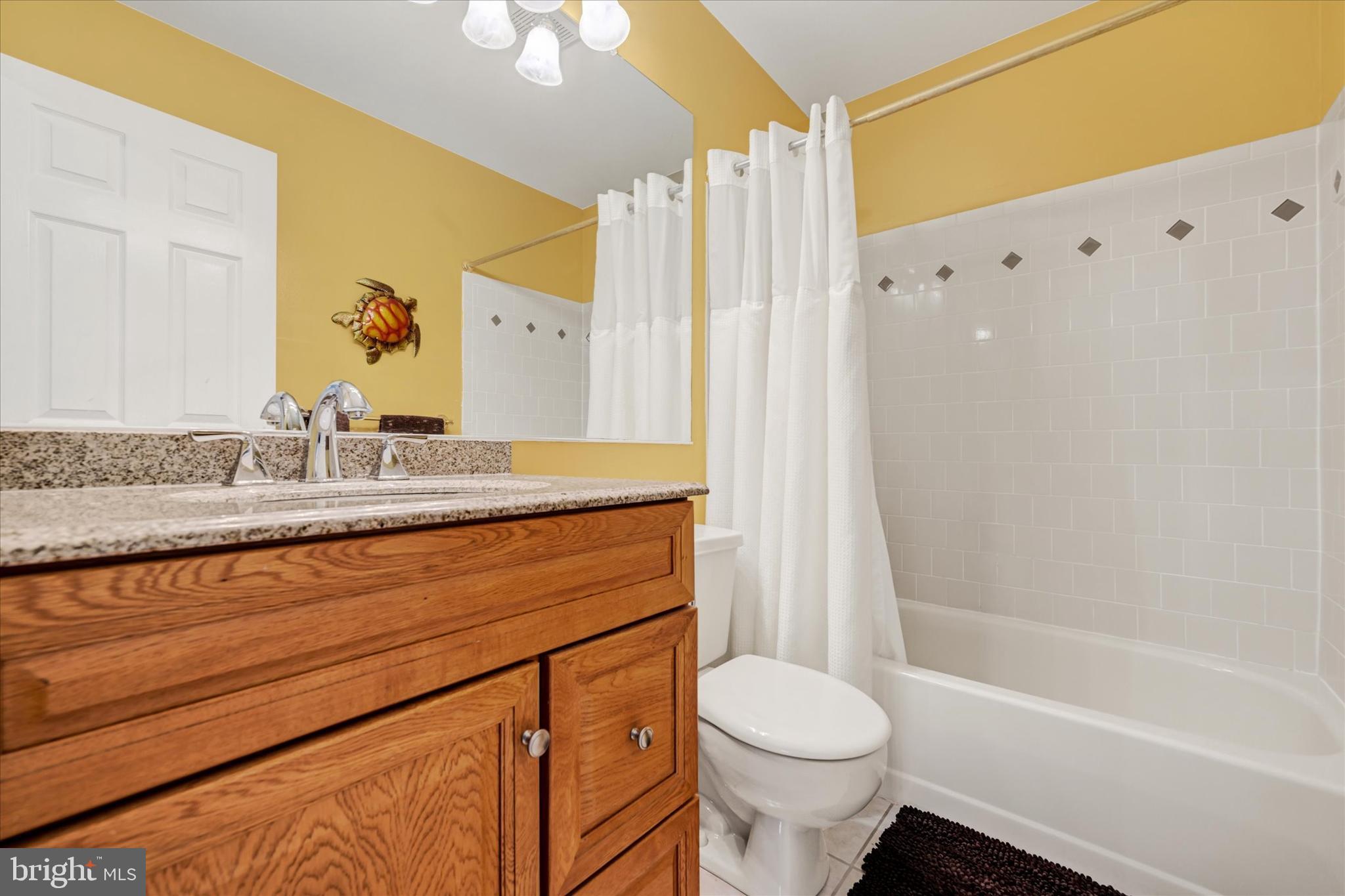 9006 Naygall Road Baltimore, MD 21234 - Photo 23 of 34 a bathroom with a granite countertop sink toilet and shower