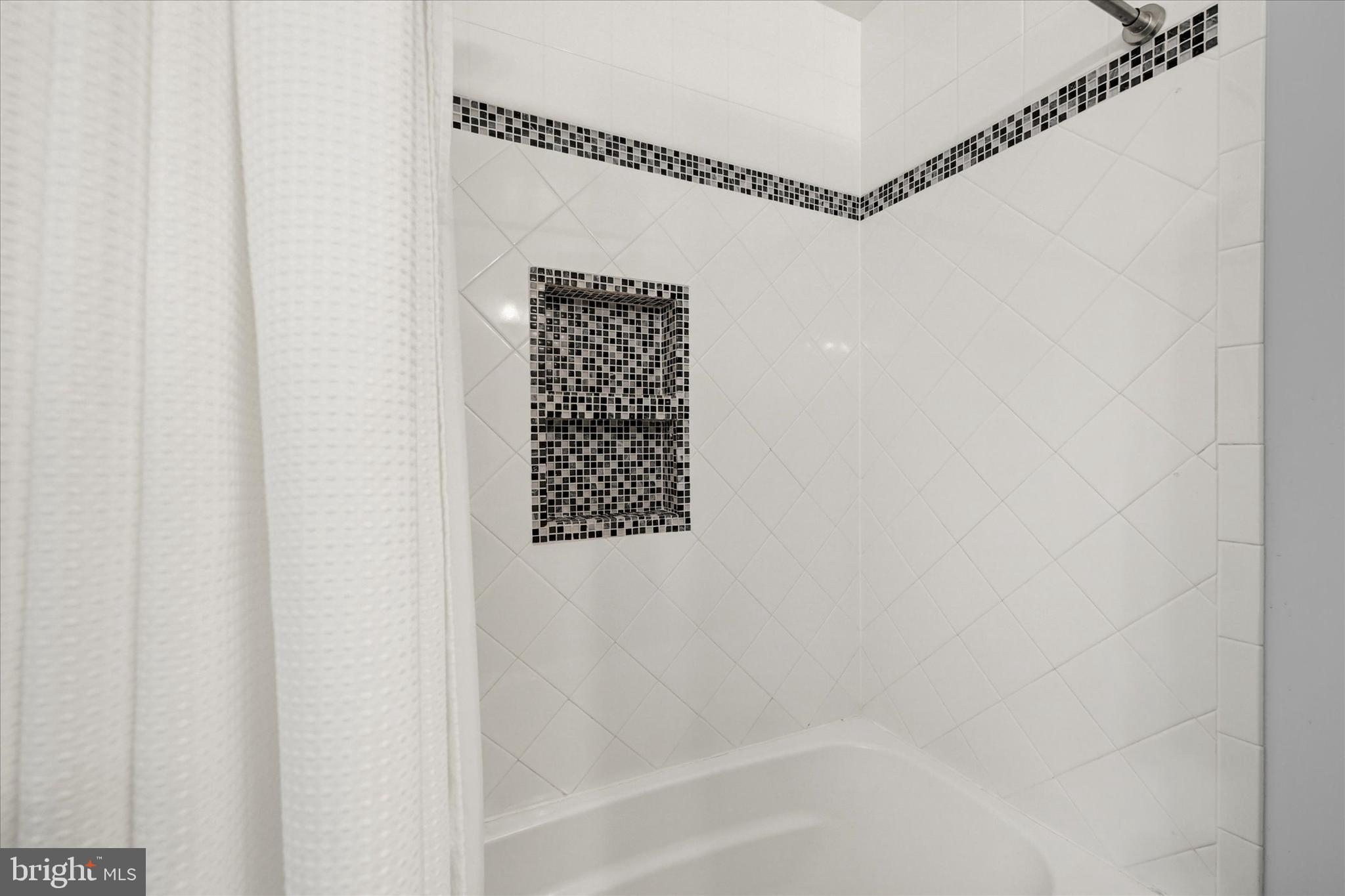 9006 Naygall Road Baltimore, MD 21234 - Photo 25 of 34 a bathroom with a shower and a bathtub
