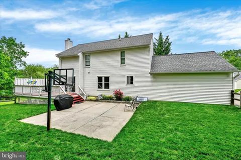 a view of a backyard with sitting area