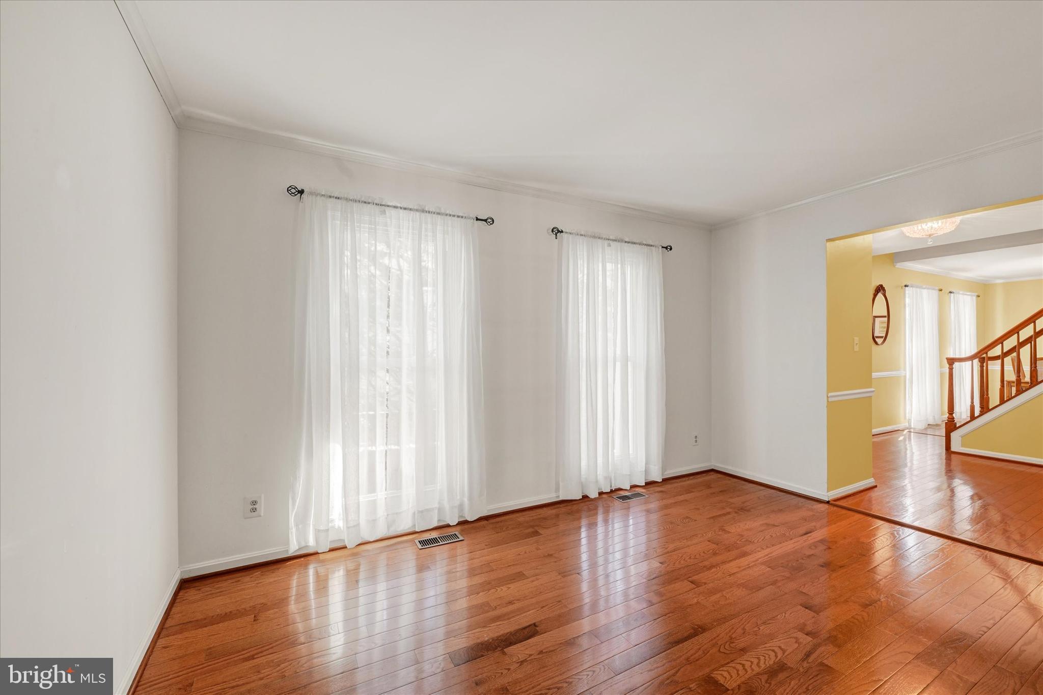 9006 Naygall Road Baltimore, MD 21234 - Photo 5 of 34 a view of empty room with wooden floor and fan