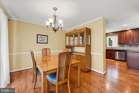 a kitchen with granite countertop a refrigerator and a sink