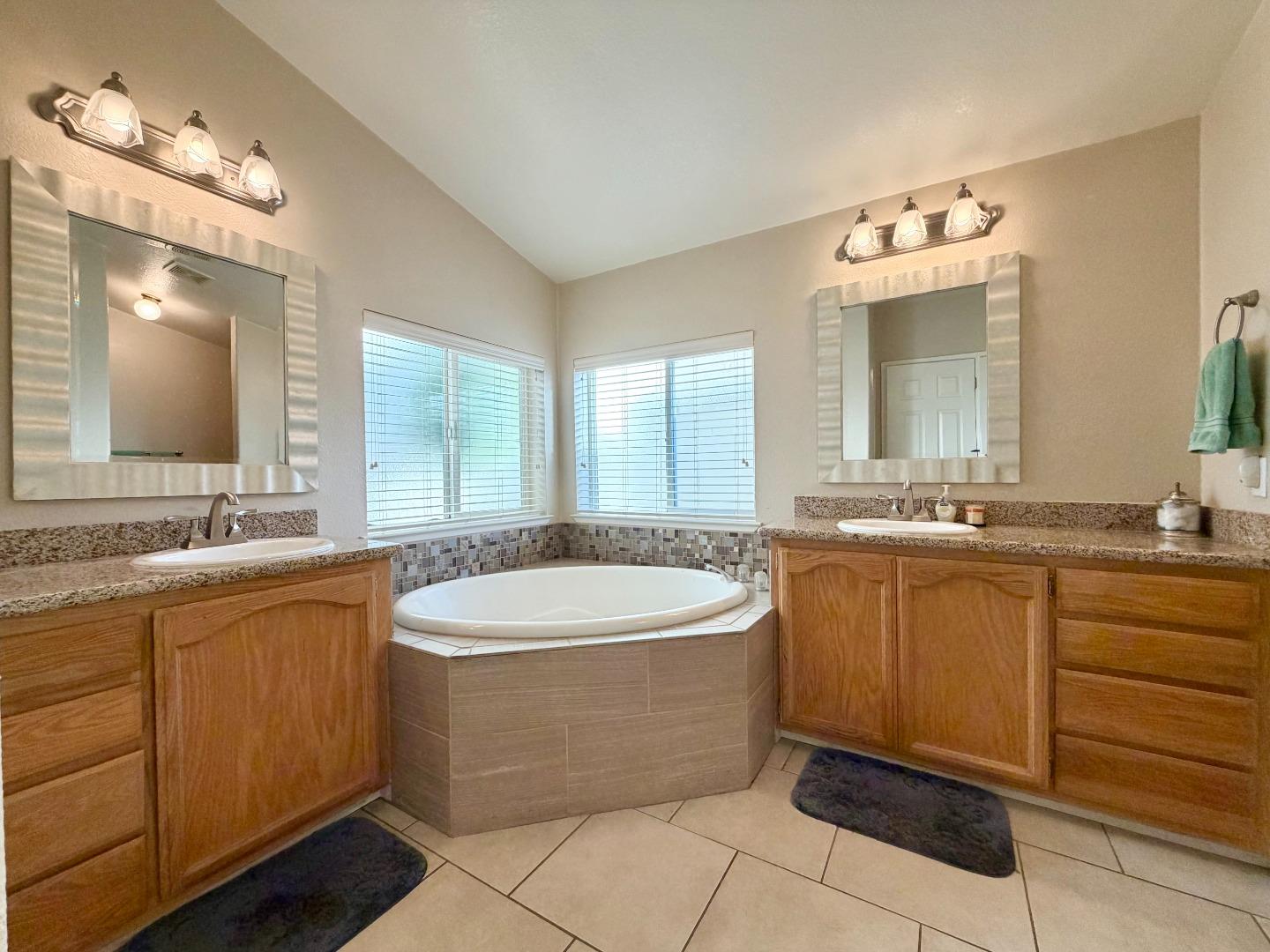 120 Dixon Landing Road, Unit 147 Milpitas, CA 95035 - Photo 18 of 21 a bathroom with a granite countertop sink and a mirror