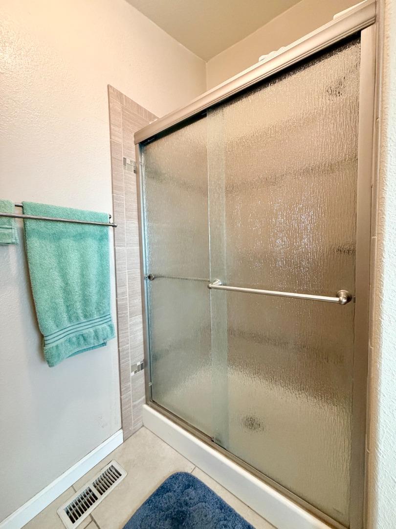 120 Dixon Landing Road, Unit 147 Milpitas, CA 95035 - Photo 19 of 21 a bathroom with a glass shower door