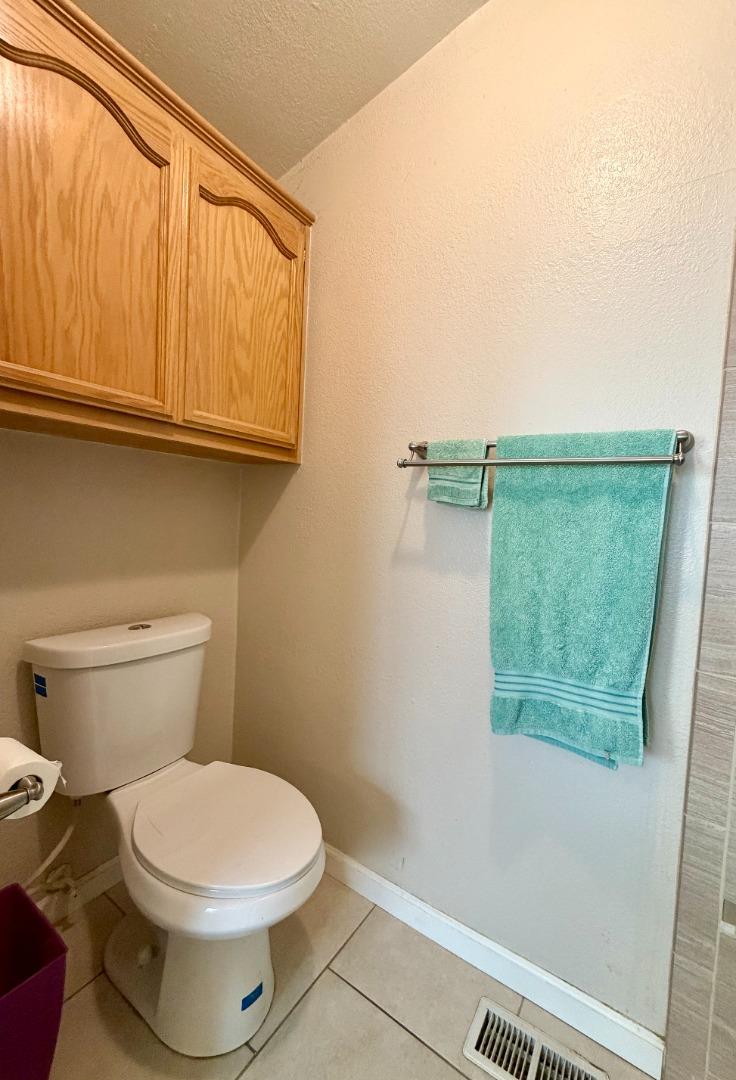 120 Dixon Landing Road, Unit 147 Milpitas, CA 95035 - Photo 20 of 21 a bathroom with a toilet and a shower