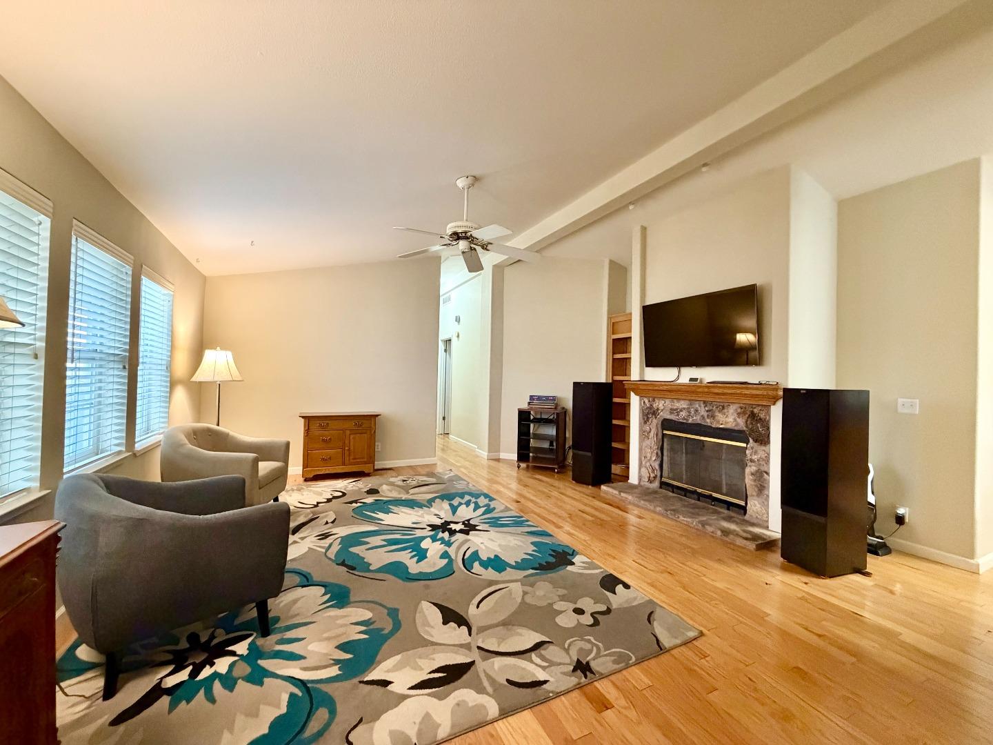 120 Dixon Landing Road, Unit 147 Milpitas, CA 95035 - Photo 3 of 21 a living room with furniture and a flat screen tv