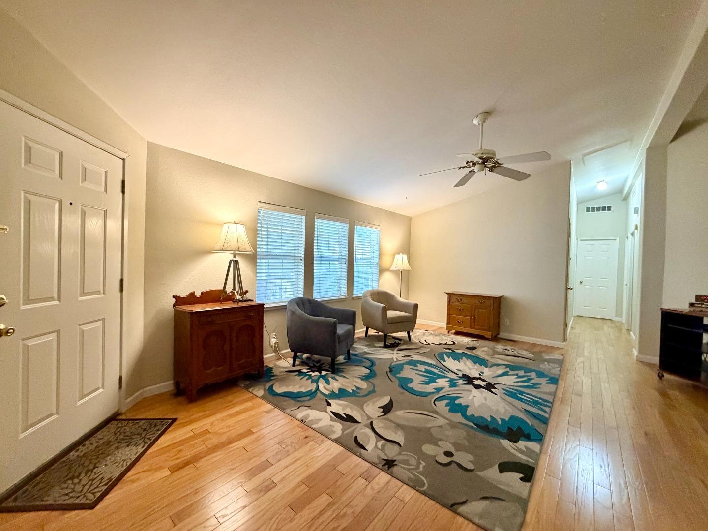 120 Dixon Landing Road, Unit 147 Milpitas, CA 95035 - Photo 4 of 21 a workspace with furniture and a wooden floor