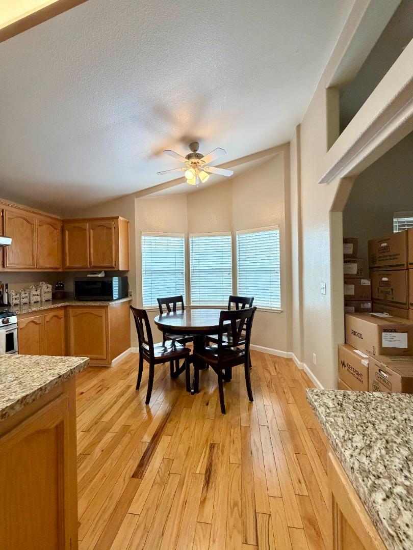 120 Dixon Landing Road, Unit 147 Milpitas, CA 95035 - Photo 8 of 21 a view of a dining room with furniture window and wooden floor
