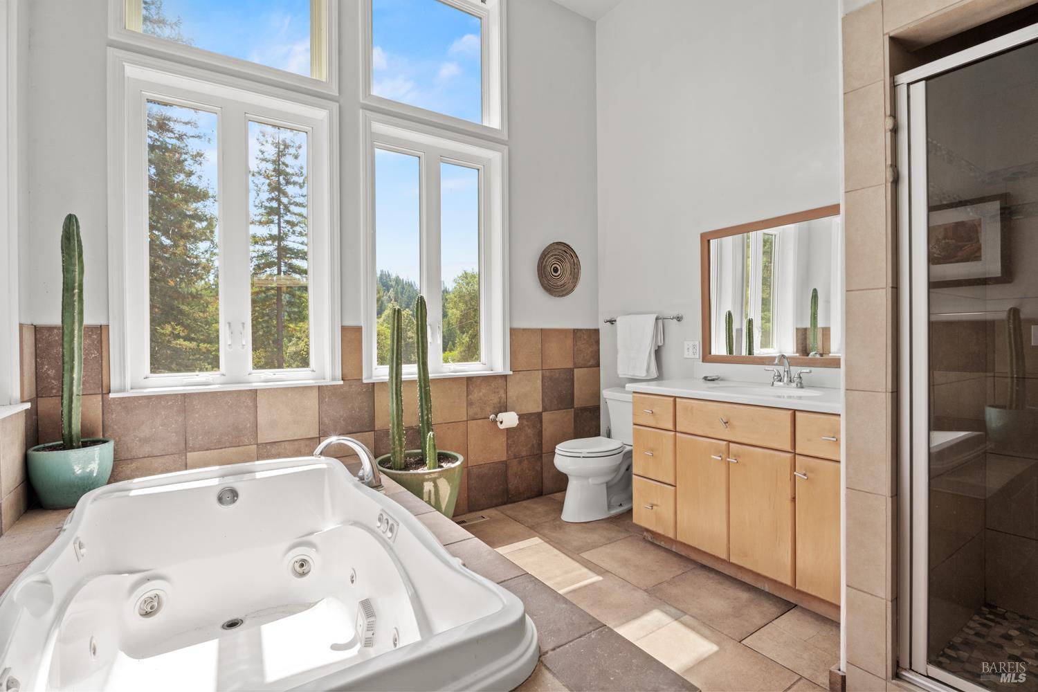 4901 Little Mill Creek Road Philo, CA 95466 - Photo 14 of 37 a bathroom with a tub sink and a large window