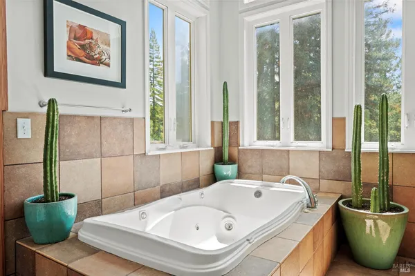 a bathroom with a tub and sink