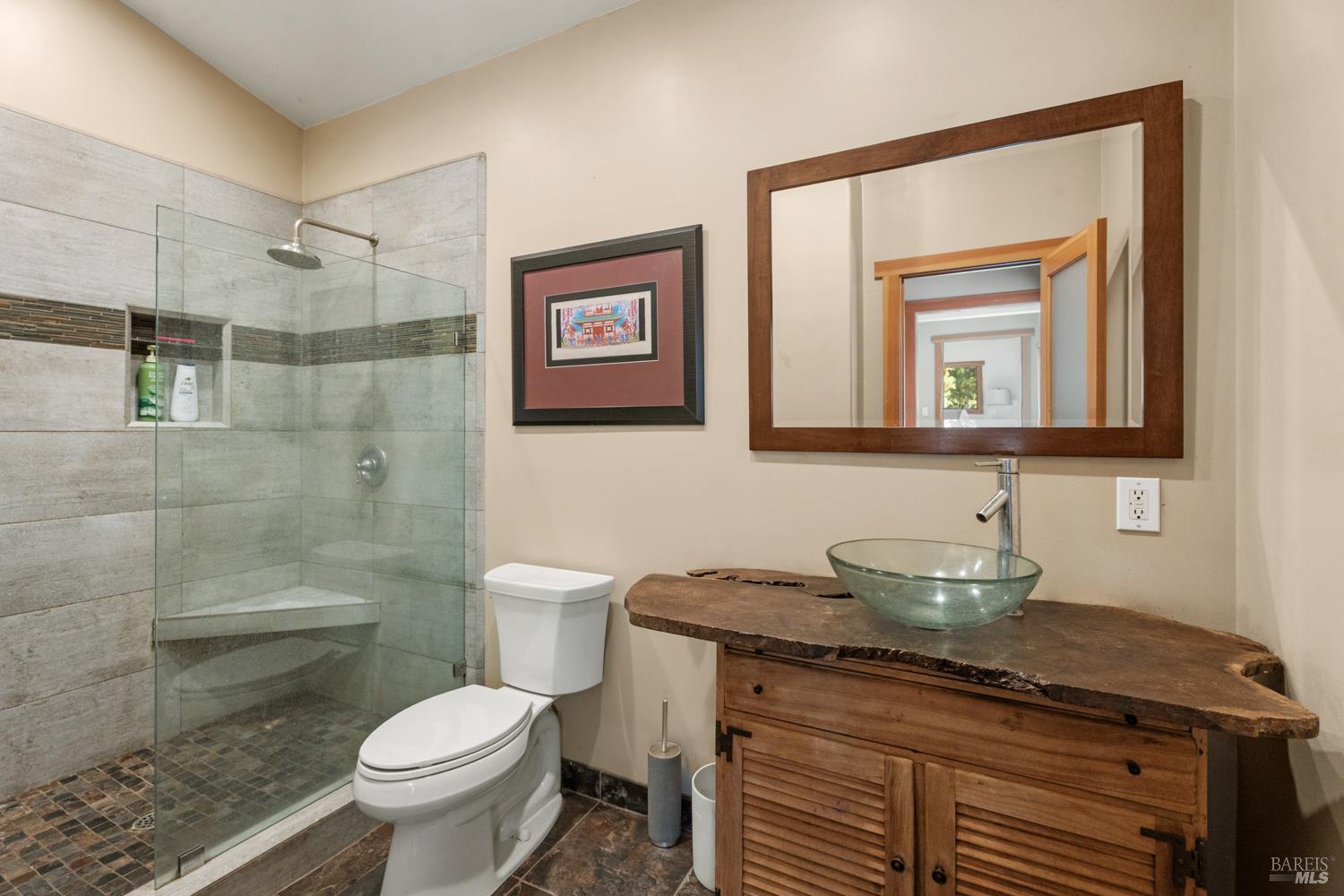4901 Little Mill Creek Road Philo, CA 95466 - Photo 19 of 37 a bathroom with a granite countertop toilet sink and mirror