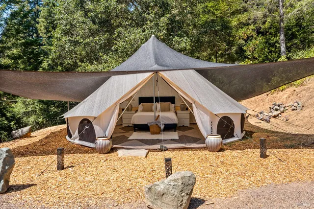 a view of a small house with a yard