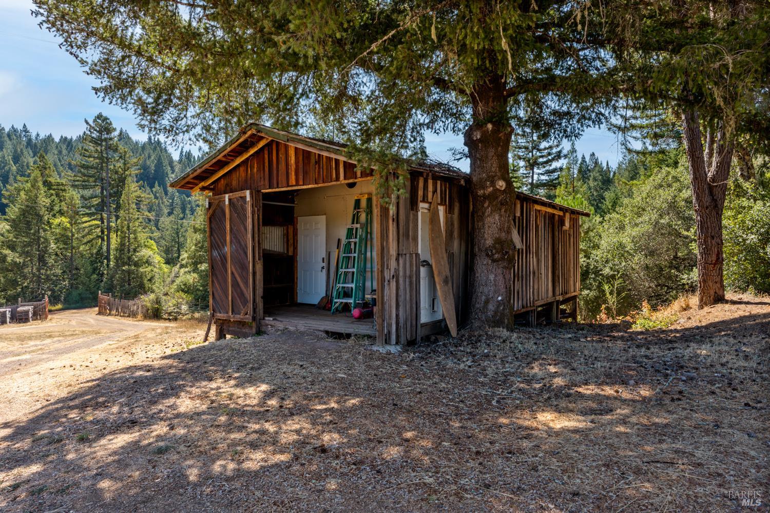 4901 Little Mill Creek Road Philo, CA 95466 - Photo 32 of 37 a view of a house with backyard and trees