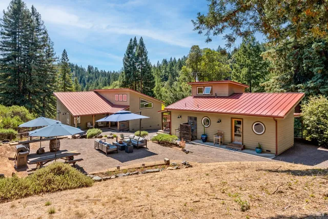 a front view of a building with trees