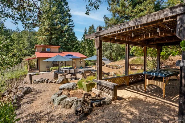 an outdoor space with furniture and umbrella