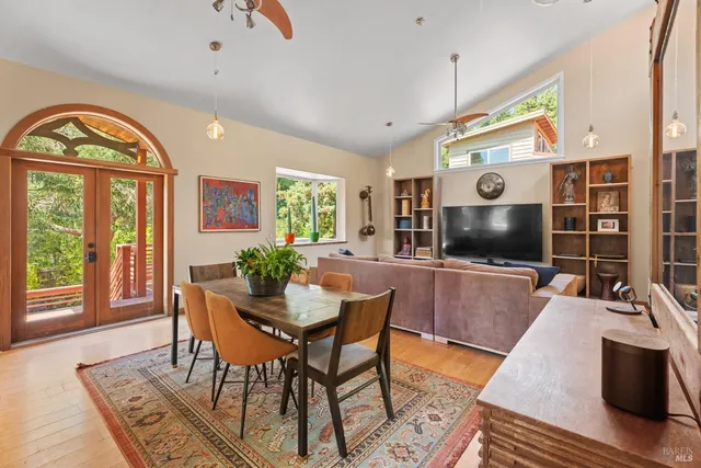 a view of a livingroom with furniture window and wooden floor