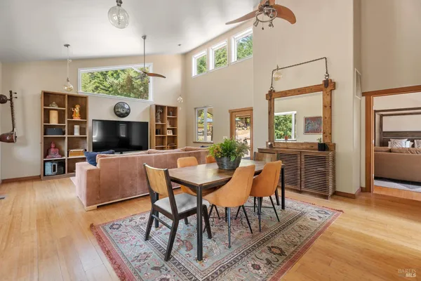 a view of a livingroom with furniture and a flat screen tv