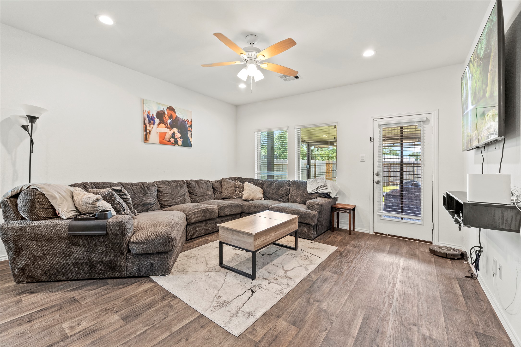 22603 Aspen Tarn Trail Spring, TX 77373 - Photo 5 of 21 a living room with furniture and a wooden floor