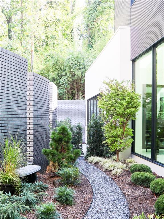 380 West Wesley Road Northwest Atlanta, GA 30305 - Photo 11 of 104 a view of a backyard with plants and large trees