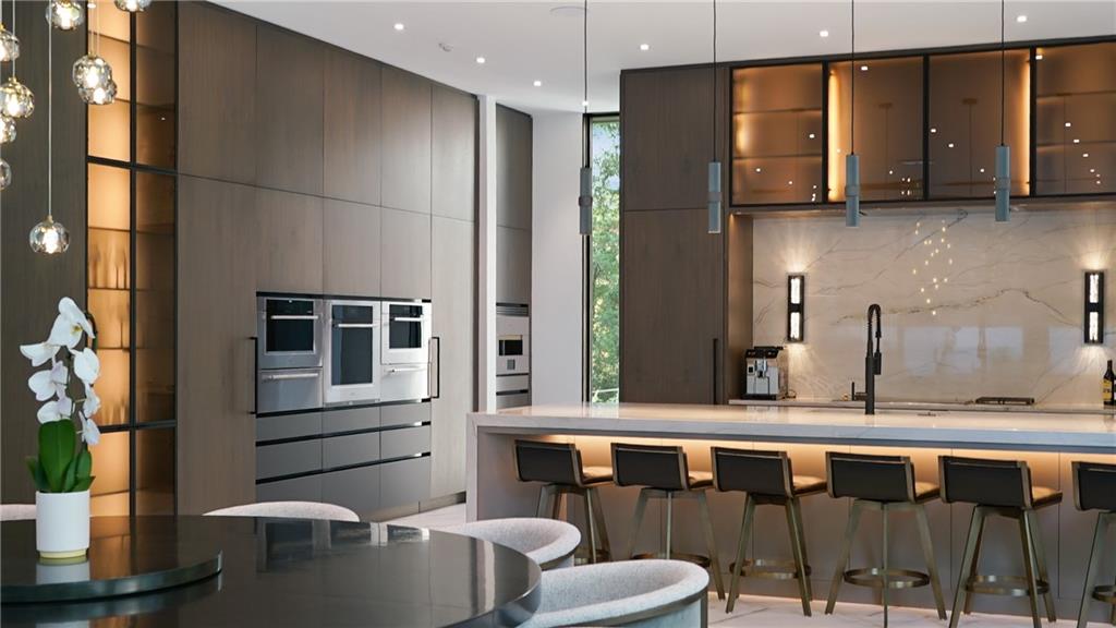 380 West Wesley Road Northwest Atlanta, GA 30305 - Photo 21 of 104 a kitchen with a sink a refrigerator and wooden cabinets