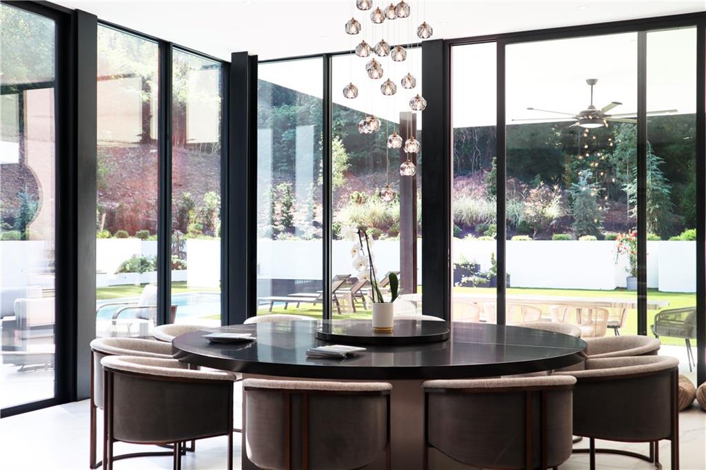 380 West Wesley Road Northwest Atlanta, GA 30305 - Photo 23 of 104 a view of a room with a large window and dining table