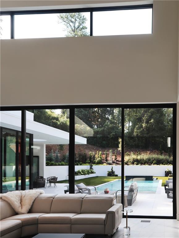 380 West Wesley Road Northwest Atlanta, GA 30305 - Photo 28 of 104 a view of a living room and floor to ceiling window or lake