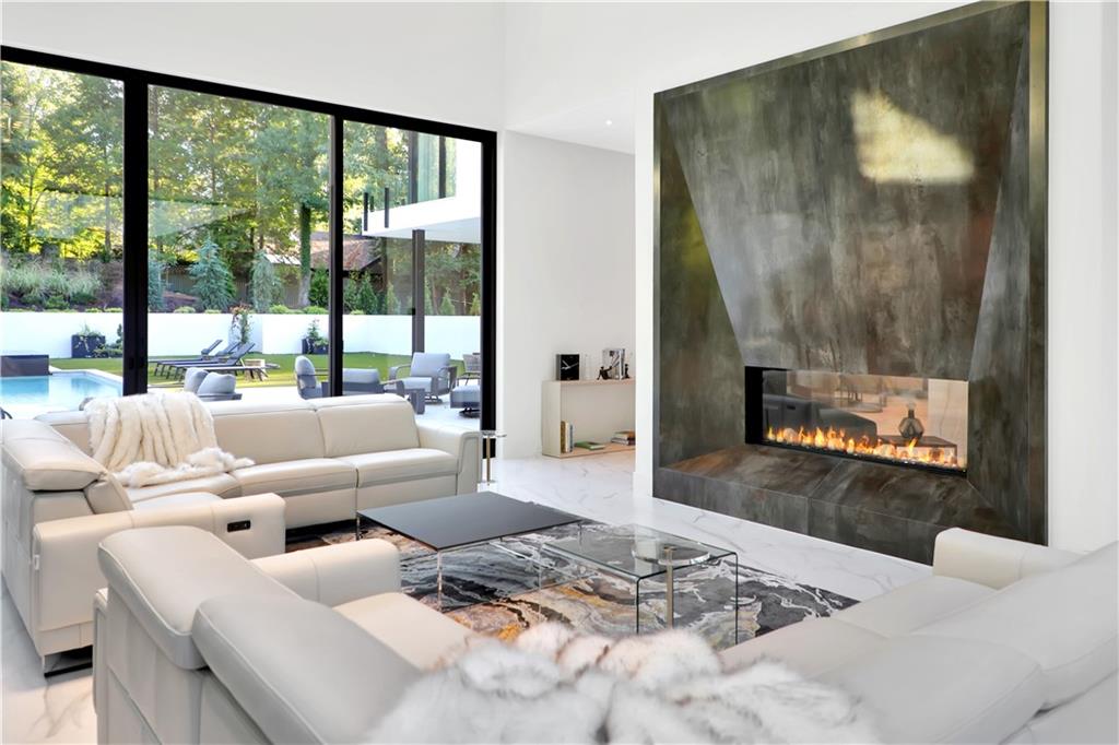 380 West Wesley Road Northwest Atlanta, GA 30305 - Photo 29 of 104 a living room with furniture and a floor to ceiling window