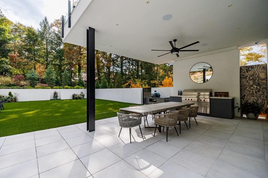 380 West Wesley Road Northwest Atlanta, GA 30305 - Photo 42 of 104 a view of a patio with a table and chairs