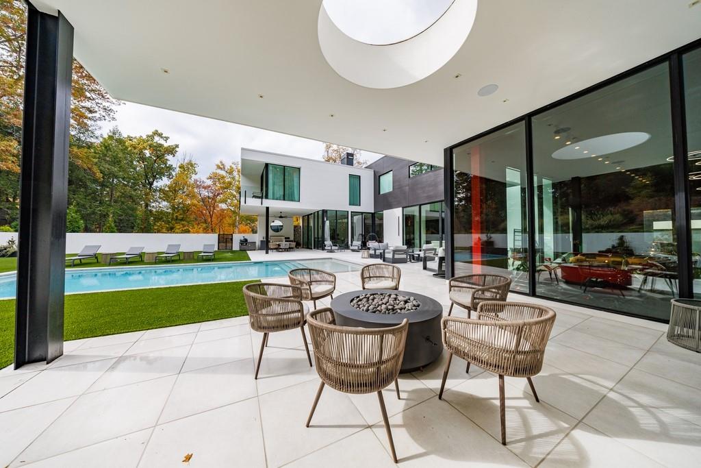 380 West Wesley Road Northwest Atlanta, GA 30305 - Photo 43 of 104 a view of a patio with a dining table and chairs