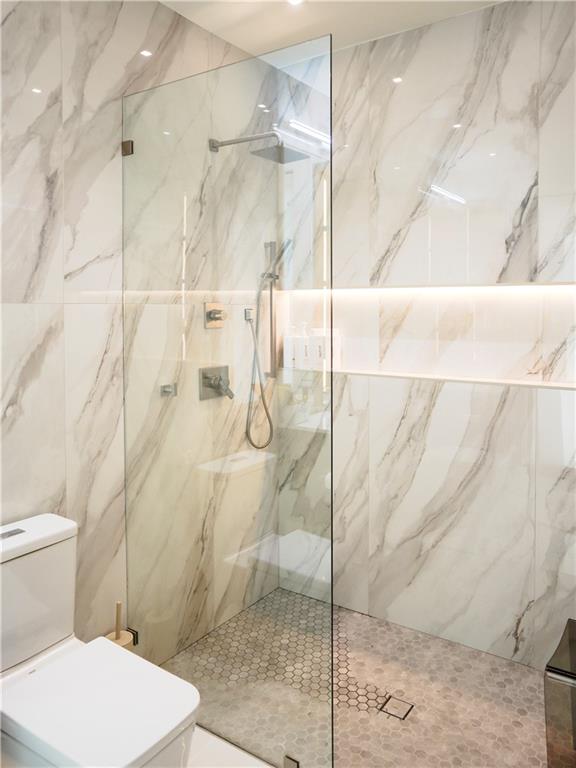 380 West Wesley Road Northwest Atlanta, GA 30305 - Photo 49 of 104 a bathroom with a toilet and a shower