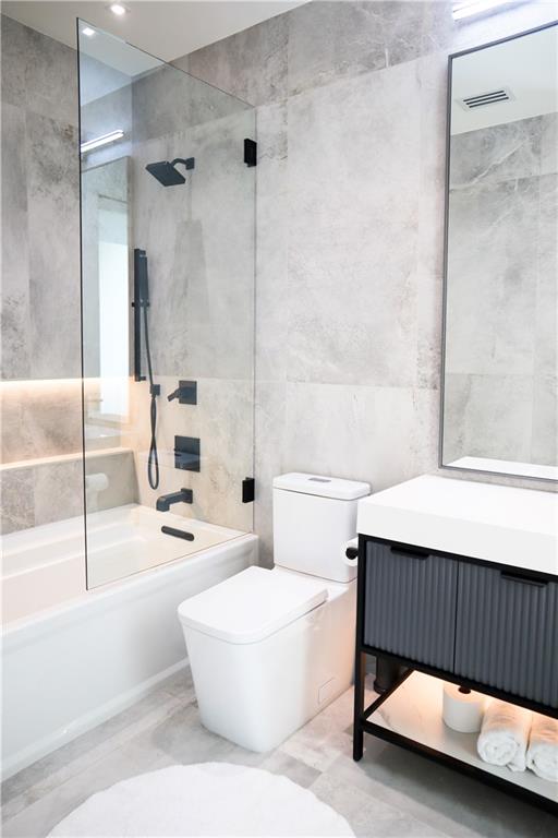 380 West Wesley Road Northwest Atlanta, GA 30305 - Photo 51 of 104 a living room with a couch and a table with wooden floor