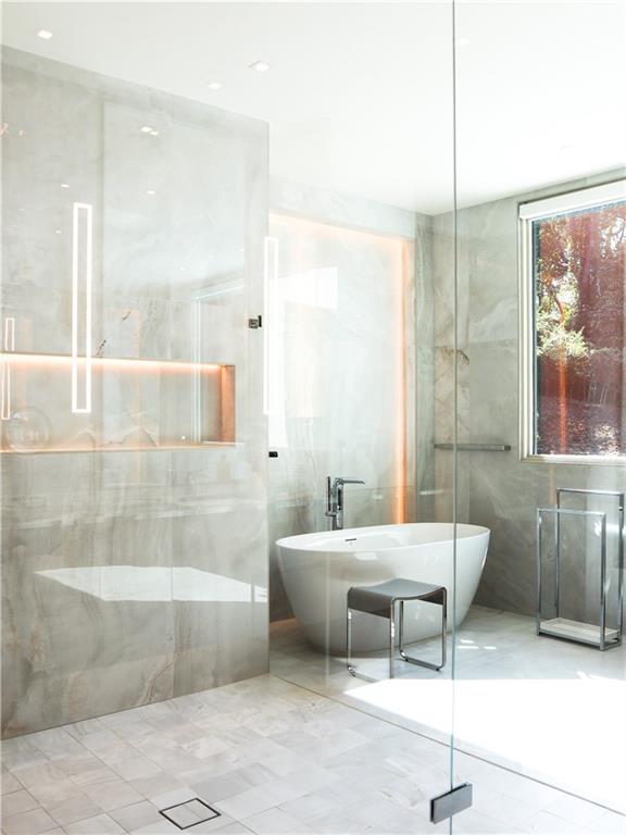 380 West Wesley Road Northwest Atlanta, GA 30305 - Photo 56 of 104 a bathroom with a tub sink and mirror