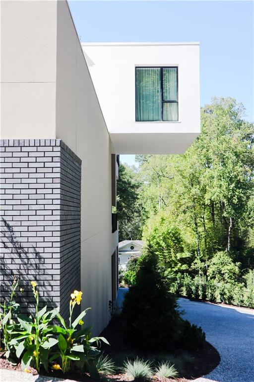380 West Wesley Road Northwest Atlanta, GA 30305 - Photo 86 of 104 a view of a garden with plants and flowers