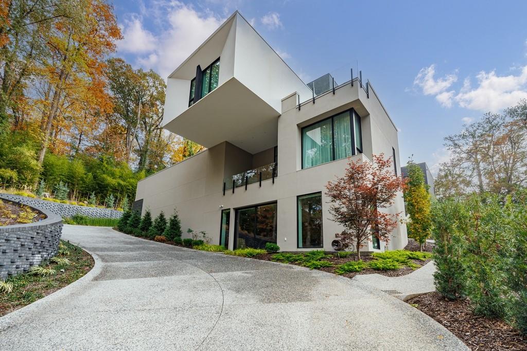 380 West Wesley Road Northwest Atlanta, GA 30305 - Photo 97 of 104 a front view of a house with garden