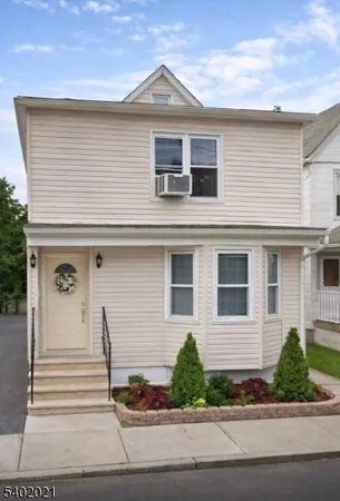 a front view of a house with a porch
