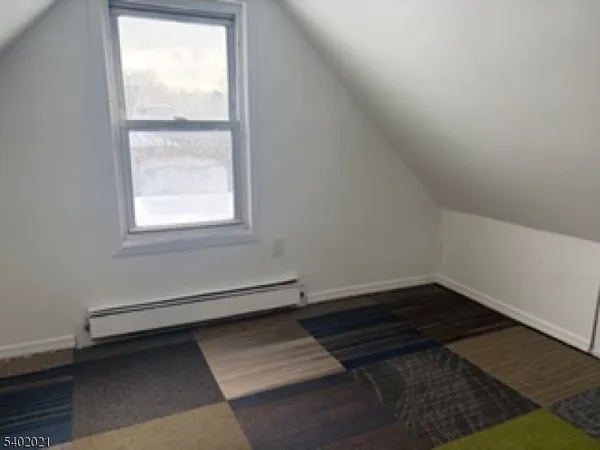 wooden floor in a hall with an entryway