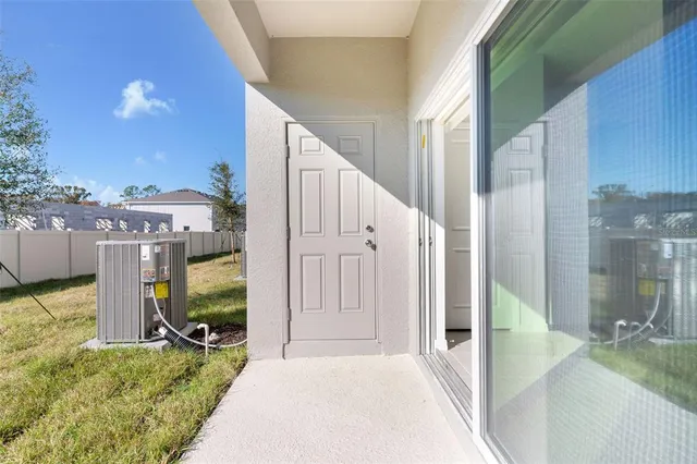 a view of a hallway with an entryway
