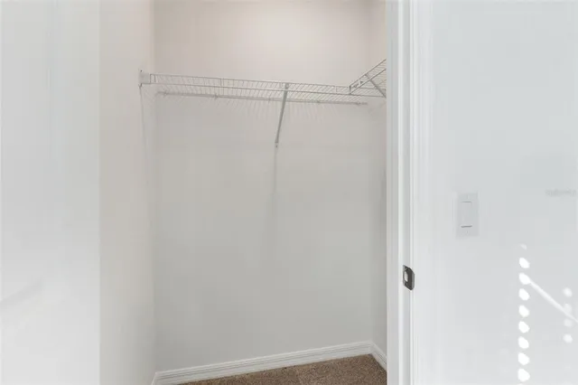 a bathroom with a sink toilet and a mirror