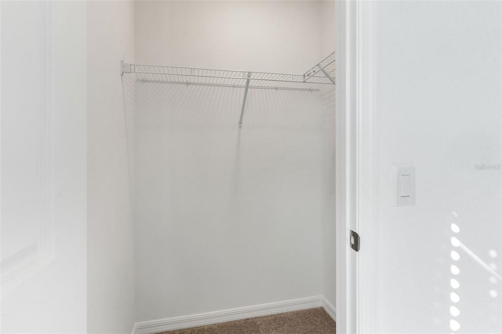 2987 Skyline Loop Kissimmee, FL 34758 - Photo 25 of 48 a view of a room with racks on the wall