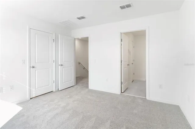 a bathroom with a shower sink vanity and mirror