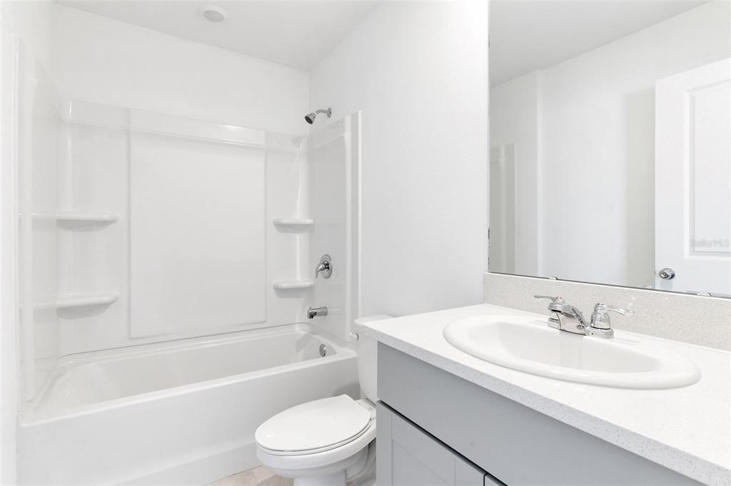 2987 Skyline Loop Kissimmee, FL 34758 - Photo 35 of 48 a bathroom with a sink a toilet and a bathtub