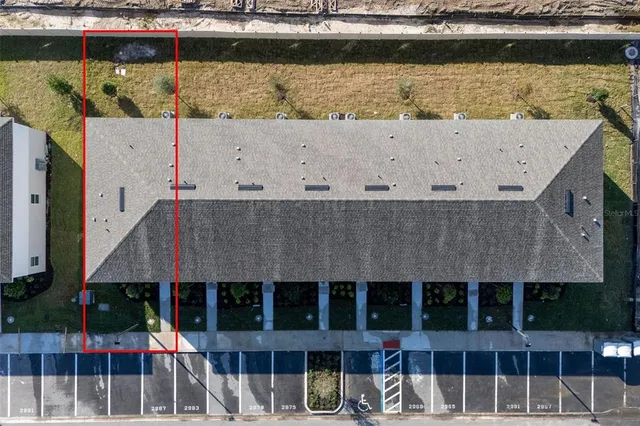 an aerial view of a swimming pool patio and mountain view