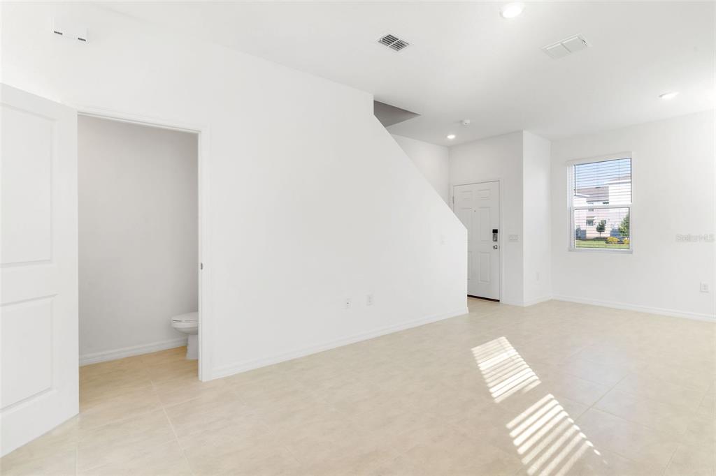 2987 Skyline Loop Kissimmee, FL 34758 - Photo 4 of 48 a view of an empty room with a window