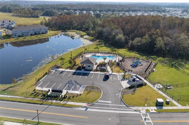 a view of a swimming pool with a yard