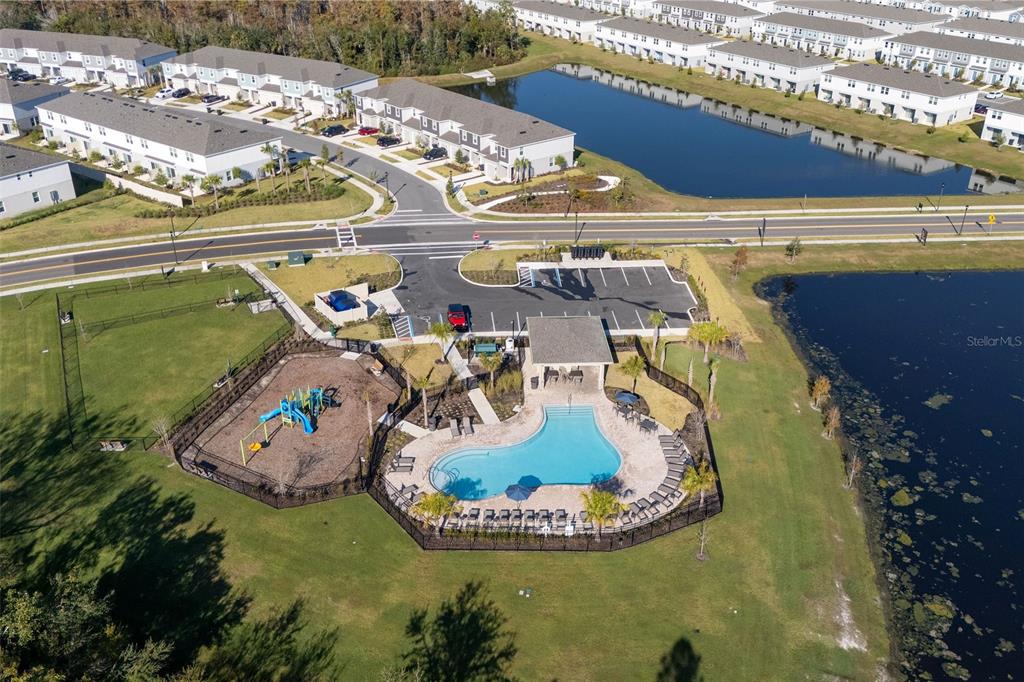 2987 Skyline Loop Kissimmee, FL 34758 - Photo 45 of 48 a view of a swimming pool with a yard
