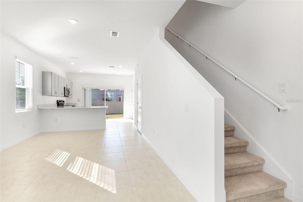 2987 Skyline Loop Kissimmee, FL 34758 - Photo 6 of 48 a view of kitchen and hall with wooden floor