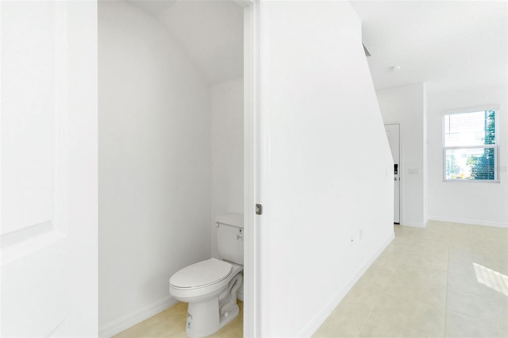 2987 Skyline Loop Kissimmee, FL 34758 - Photo 8 of 48 a white toilet sitting next to a white sink